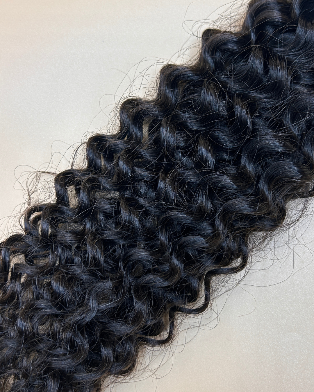 Tissage Dakar frisé noir de la marque Olimahair 
